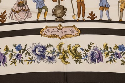 Lot 585 - A ‘Les Jardiniers Du Roy’ silk scarf by Hermès,...
