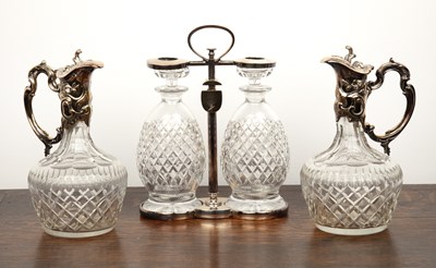 Lot 291 - Pair of silver plated cut glass claret jugs ...