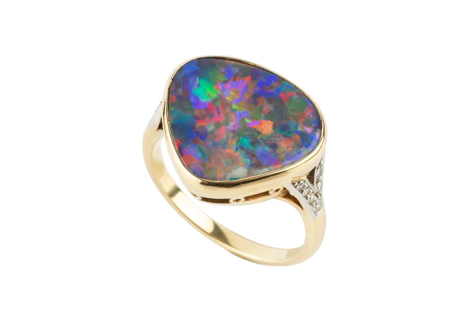 Lot An opal and diamond ring, the opal of rounded...