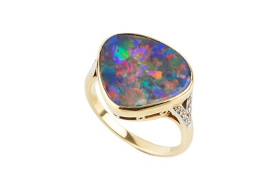 Lot An opal and diamond ring, the opal of rounded...