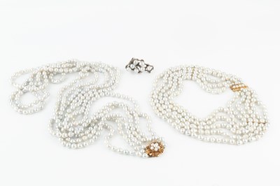 Lot 133 - A triple strand freshwater pearl long necklace,...