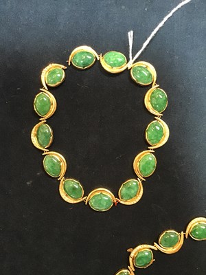 Lot 134 - An 18k gold, green stone and diamond necklace,...