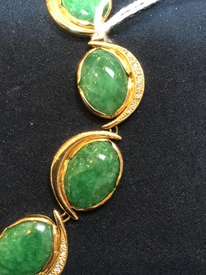 Lot 134 - An 18k gold, green stone and diamond necklace,...