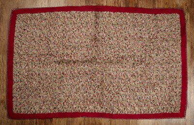 Lot 54A - Polychrome textured wool rug with a bright red...