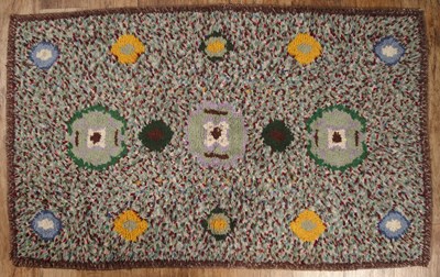 Lot 53A - Polychrome textured wool rug with a circular...