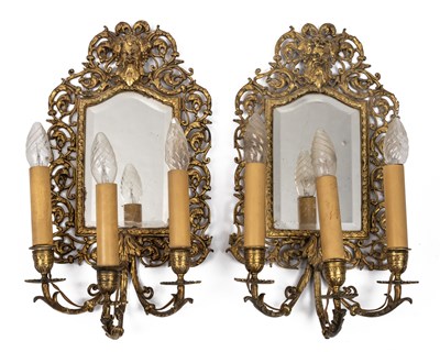 Lot 439 - A pair of brass framed girandole mirrors