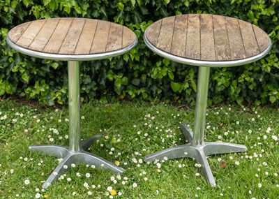 Lot 1295 - A pair of chrome and wood bistro tables