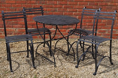 Lot 1329A - A garden table and four chairs