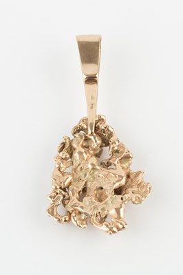 Lot A yellow gold nugget pendant, of abstract form,...