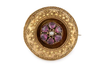 Lot 35 - A Victorian gem set panel brooch, the circular...