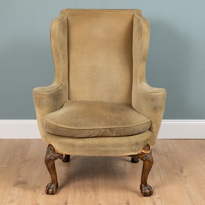 Lot 171 - A George II style wing back armchair