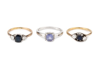 Lot 206 - A sapphire and diamond three stone ring, the...