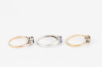 Lot 206 - A sapphire and diamond three stone ring, the...
