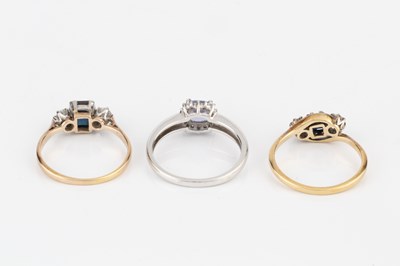 Lot 206 - A sapphire and diamond three stone ring, the...