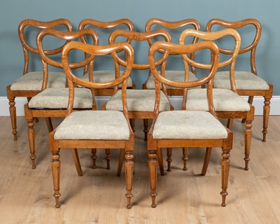 Lot 29 - A set of nine Victorian Maplewood balloon-back dining chairs