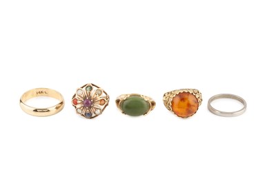 Lot 89 - A collection of rings, comprising a green...