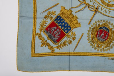 Lot 584 - A ‘Les Armes de Paris’ silk scarf by Hermès,...