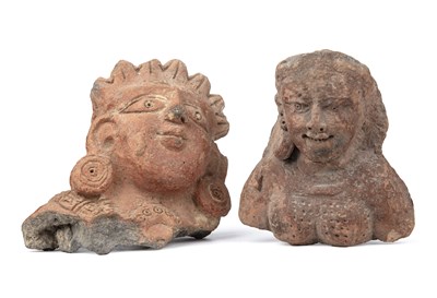 Lot 419 - Two terracotta heads of a deities central...