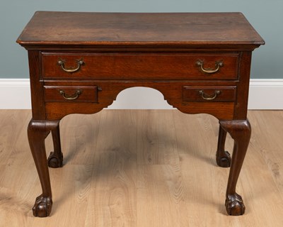 Lot 344 - A George II oak lowboy