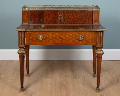 Lot 261 - A French Louis XVI style parquetry metamorphic writing table