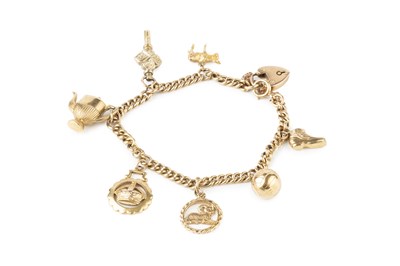 Lot 151 - A 9ct gold curb link charm bracelet, with...