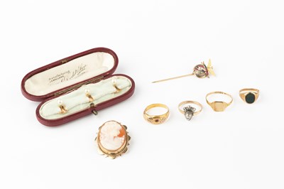 Lot 131 - A diamond and gem set stick pin, in the form...