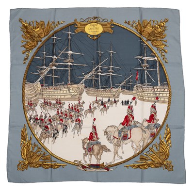 Lot 589 - A ‘Marine et Cavalerie’ silk scarf by Hermès,...