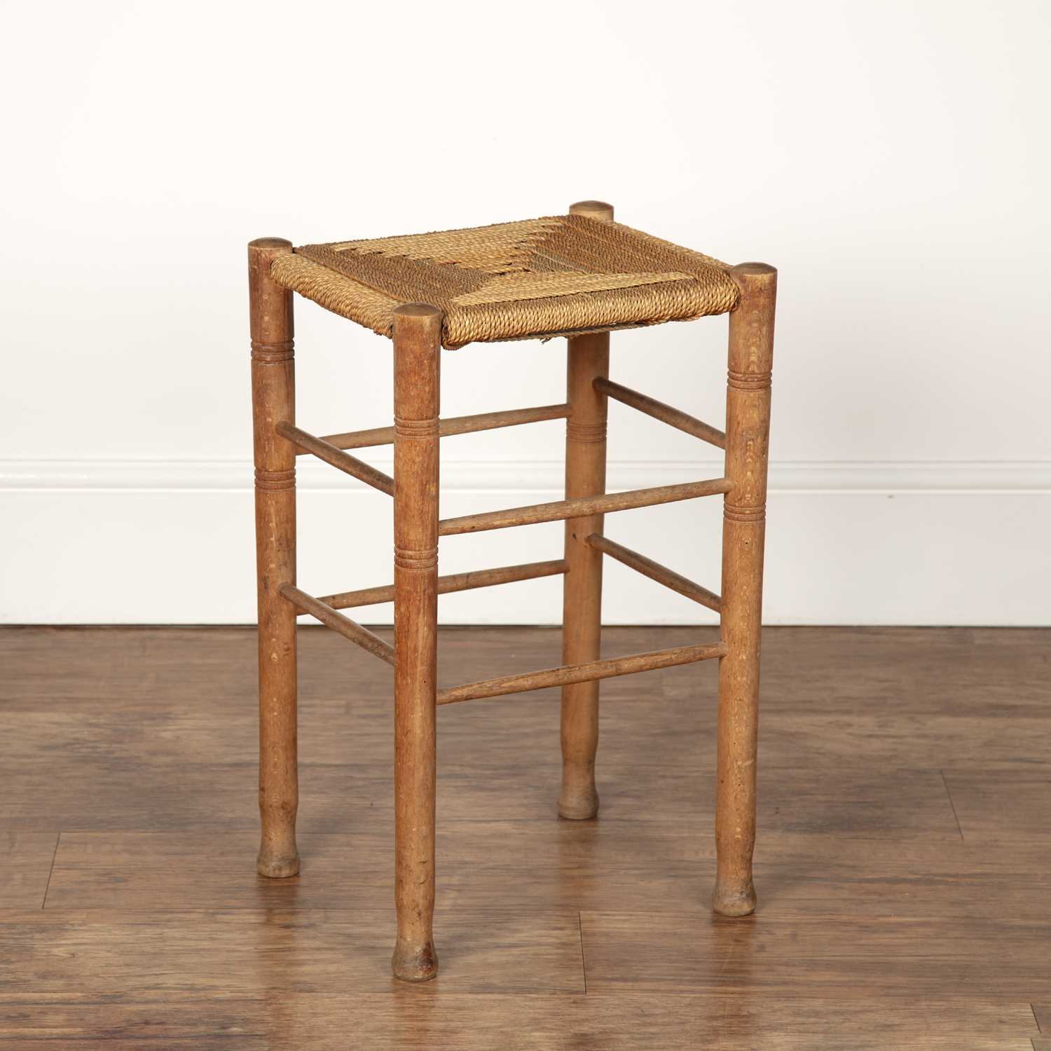 Lot 28 - Cotswold School two stools with raffia strung...