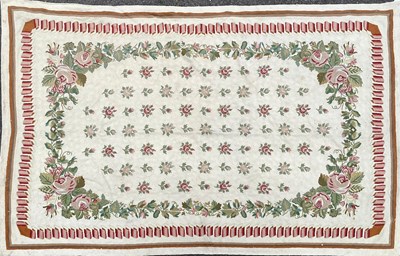 Lot 1276 - A cream ground needlework rug