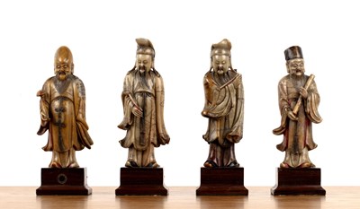 Lot Set of four soapstone-carved models of Taoist...