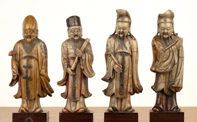 Lot 422 - Set of four soapstone-carved models of Taoist...