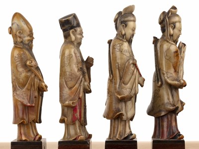 Lot 422 - Set of four soapstone-carved models of Taoist...