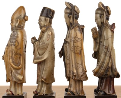 Lot 422 - Set of four soapstone-carved models of Taoist...