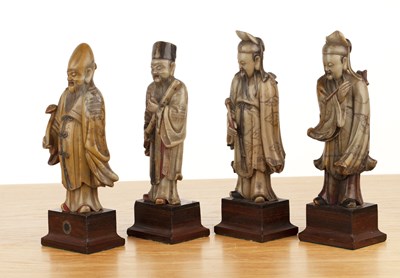 Lot 422 - Set of four soapstone-carved models of Taoist...