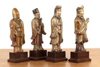 Lot 422 - Set of four soapstone-carved models of Taoist...