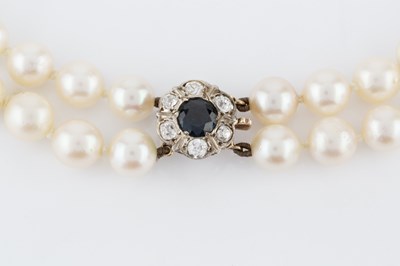 Lot 240 - A cultured pearl necklace with gem set clasp,...