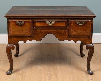 Lot 711 - A large 19th century oak lowboy