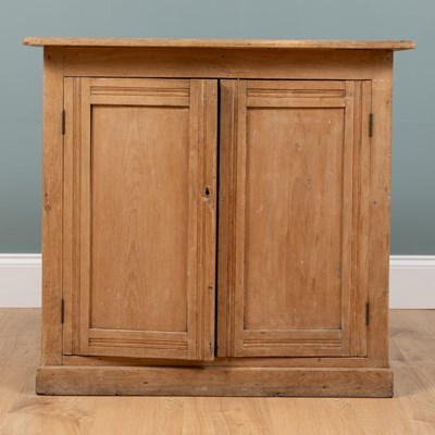 Lot 497 - A small pine two-door kitchen cupboard