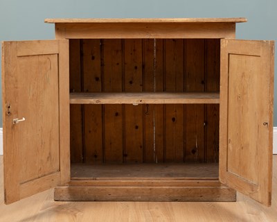 Lot 497 - A small pine two-door kitchen cupboard