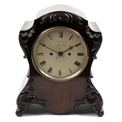 Lot 696 - A 20th century mahogany table clock