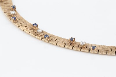 Lot 247 - A diamond and sapphire collar necklace by Roy...