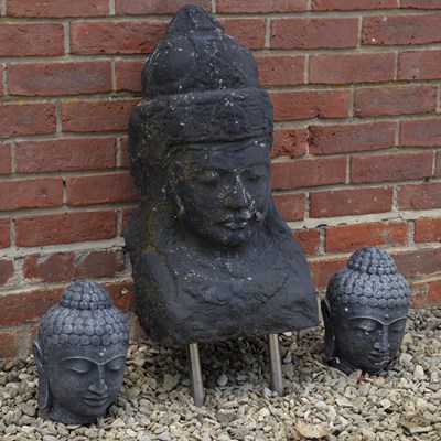 Lot 1407 - Three cast stone Buddha heads