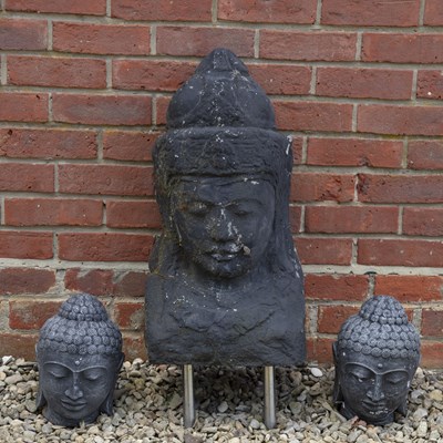 Lot 1407 - Three cast stone Buddha heads