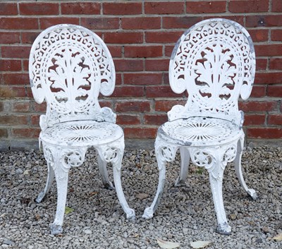 Lot 1406 - A pair of cast aluminium white-painted garden chairs