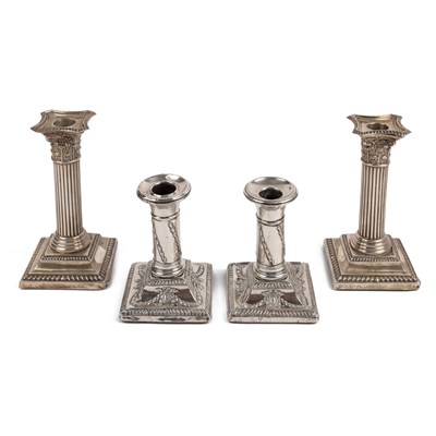 Lot 228 - A pair of Edwardian silver candlesticks, with...