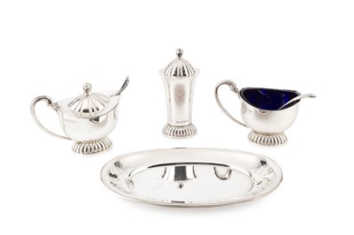 Lot 709 - A George VI planished silver three piece cruet...