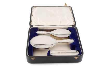 Lot 713 - A silver backed four piece dressing table set,...