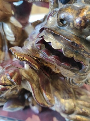 Lot 537 - A Chinese carved gilt and painted sculpture stand