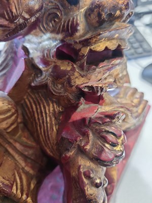 Lot 537 - A Chinese carved gilt and painted sculpture stand