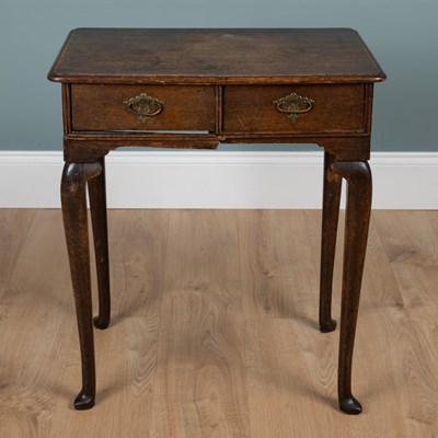 Lot 384 - A George III oak side table